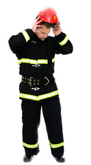 Vertical Isolated Photo of a Firefighter in uniform with a red helmet in his hands