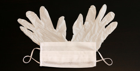 White latex protective gloves and medical mask