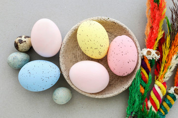 Obraz na płótnie Canvas Colorful, painted Easter eggs on a ceramic bowl.