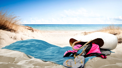 Beach background of free space and towel on sand 