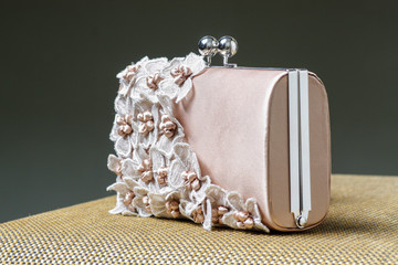 Beautiful wedding purse decorated with lace flowers.
