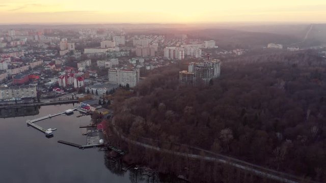 Top view of sunset over city near lake. Ternopil, Ukraine. Lake Ternopil.