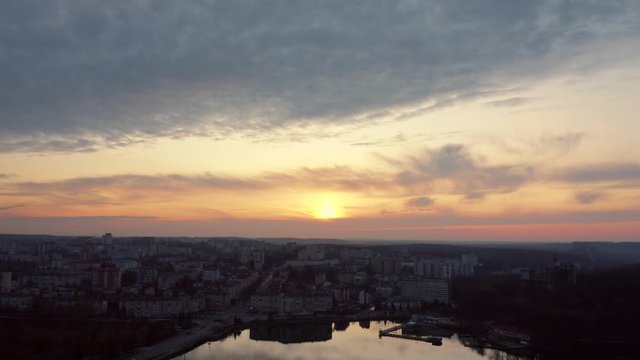 Top view of sunset over city near lake. Ternopil, Ukraine. Lake Ternopil.