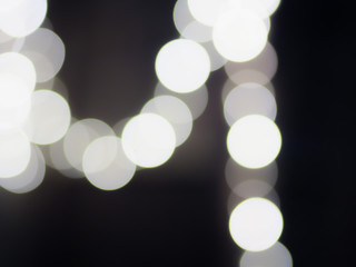 Black and white bokeh background.