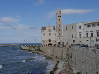 Fototapeta na wymiar Trani – Cathedral of Saint Nicholas the Pilgrim with romanesque facade and the bell tower built using the white local stone