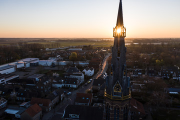 A church during sunrise on a sunny morning in the dutch town of Waalwijk, Noord Brabant, Netherlands