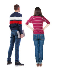 Naklejka premium Back view couple with laptop in sweater.