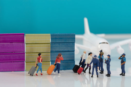 Security Airport Travel Restrictions Concept Images - Miniature Toy Figures Of Police Or Border Patrol Officers Stopping Passengers Of A Plane.