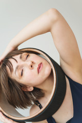 Obraz premium Woman is engaged with a yogi ring on her head