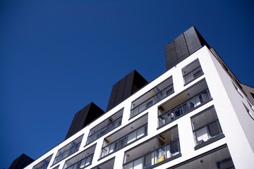 Modern european apartment building with balconies on a clear sunny day