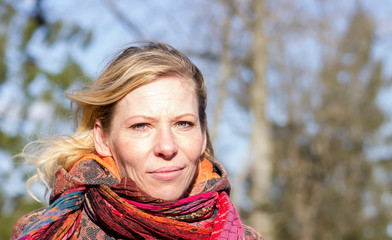 40 years old, portrait of a beautiful woman in close-up outdoors