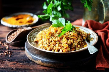 Buckwheat stew with vegetables in a ceramic bowl. rustic