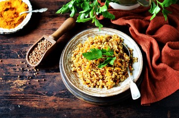 Buckwheat stew with vegetables in a ceramic bowl. rustic