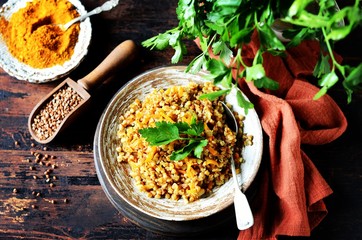 Buckwheat stew with vegetables in a ceramic bowl. rustic