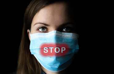 Stop the virus and epidemic diseases. Woman in medical mask on black background. Time of quarantine. Coronavirus pandemia. Virus danger infection. Cold or flu illnesses.
