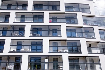 Modern european apartment building with balconies on a clear sunny day