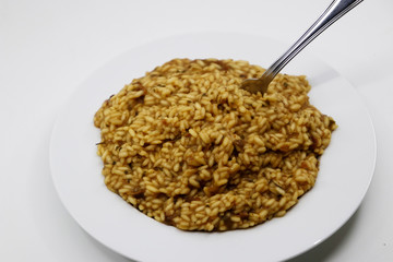 Risotto with mushrooms in white background