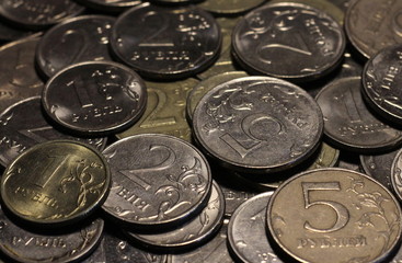 A lot of rubles in a pile. Coins: 1, 2, 5. "Ruble"