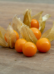 cape gooseberry fruits on a wooden board closeup