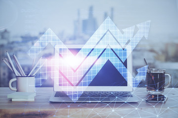 Computer on desktop with point up arrows hologram. Double exposure. Concept of success.