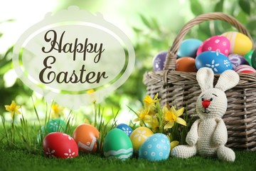 Composition with colorful eggs and text Happy Easter on blurred background