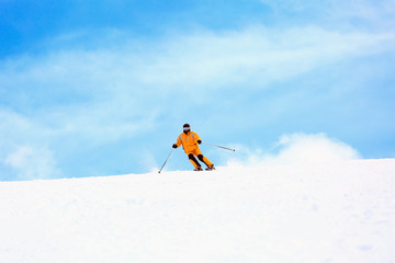 Naklejka na ściany i meble a man with ski equipment on the top of the mountain 