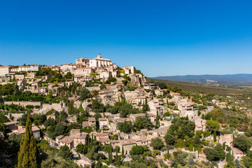 Obraz premium View of Gordes, a small medieval town in Provence, France. A view of the ledges of the roof of this beautiful village and landscape.