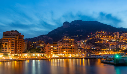 Obraz premium Night view on Fontvieille and Monaco Harbor and view at the Cathedral the Monaco