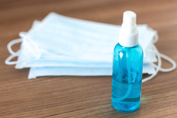 Alcohol bottle spray and face mask or medical mask for coronavirus protection covid-19