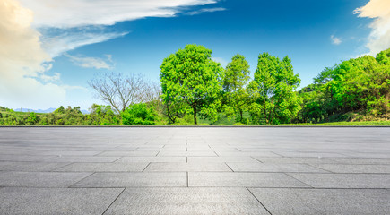 Empty square floor and green tea mountain nature landscape on sunny day,panoramic view.