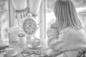 young model drinks tea in a cafe, vacation concept table setting
