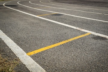 black tarmac asphalt of running track, athletic sport background