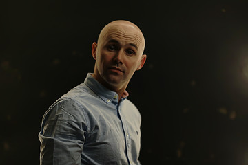 young bald guy portrait in studio