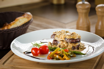 Roasted Turkish meat balls with baked potatoes and green chilly pepper on the wooden background. Roasted Turkish cutlets.