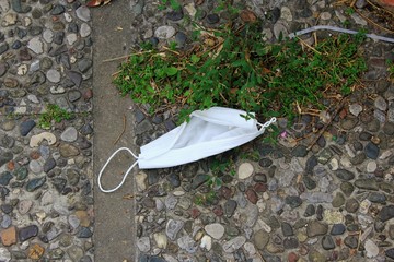 Athens, Greece, March 22 2020 - Surgical mask thrown at park during coronavirus outbreak.