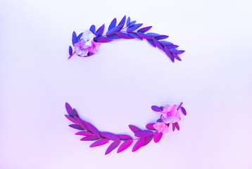 Light neon background with leaves. Colorful abstract backdrop with plants frame and space for your text. Exotic nature branch with pink and purple vivid colors. Summer twigs with shiny backlight