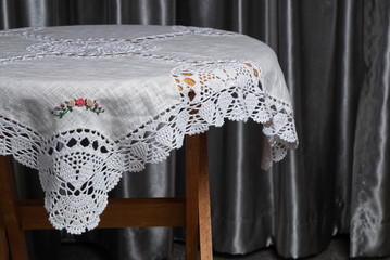 Beautiful Lace Fabric on Wood Table indoor Decoration.