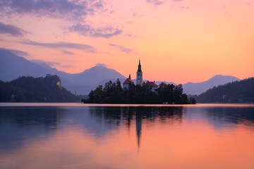 A beautiful colorful sunrise at Lake Bled in Slovenia. In the background you can see the Alps mountains.