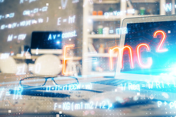 Desktop computer background and formula hologram writing. Double exposure. Education concept.