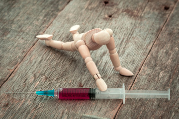 Sick man trying to grab syringe with vaccine from virus