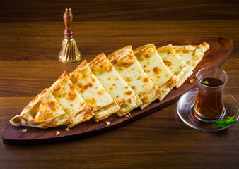 Hot Turkish pide pizza closeup on a wooden table. horizontal top view
