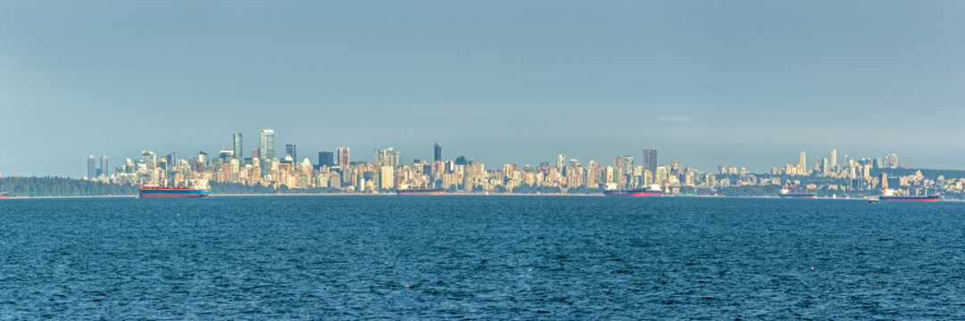 Panoramic cityscape of Vancouver, skyline view from the ocean British Columbia, Canada