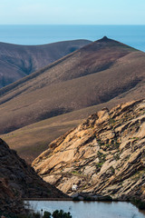 Hermitage of Our Lady of the Pena (Betancuria) in the valley and mountains at Vega de Rio Palmas Betancuria Fuerteventura Canary Islands