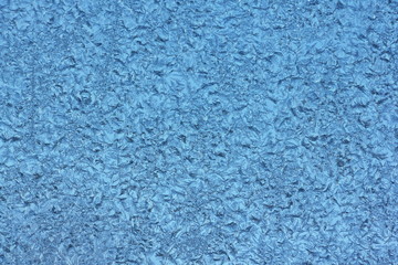 Blue hoar crystals background texture on glass
