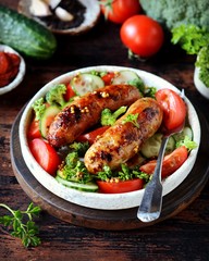 Homemade chicken (turkey) fried sausages with broccoli, tomato and cucumber salad 