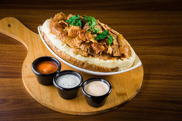Turkish national dish called 'kumpir' which is baked potato stuffed with vegetables