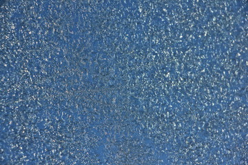 Blue hoar background texture on glass