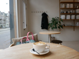 Flat white coffee in a trendy amsterdam coffee shop 