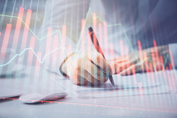 Financial trading chart multi exposure with man desktop background.