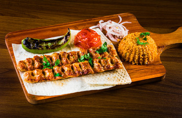 Various barbecued kebabs - kofta, chicken tawook and sumac chicken - with tabouleh and pitta bread...